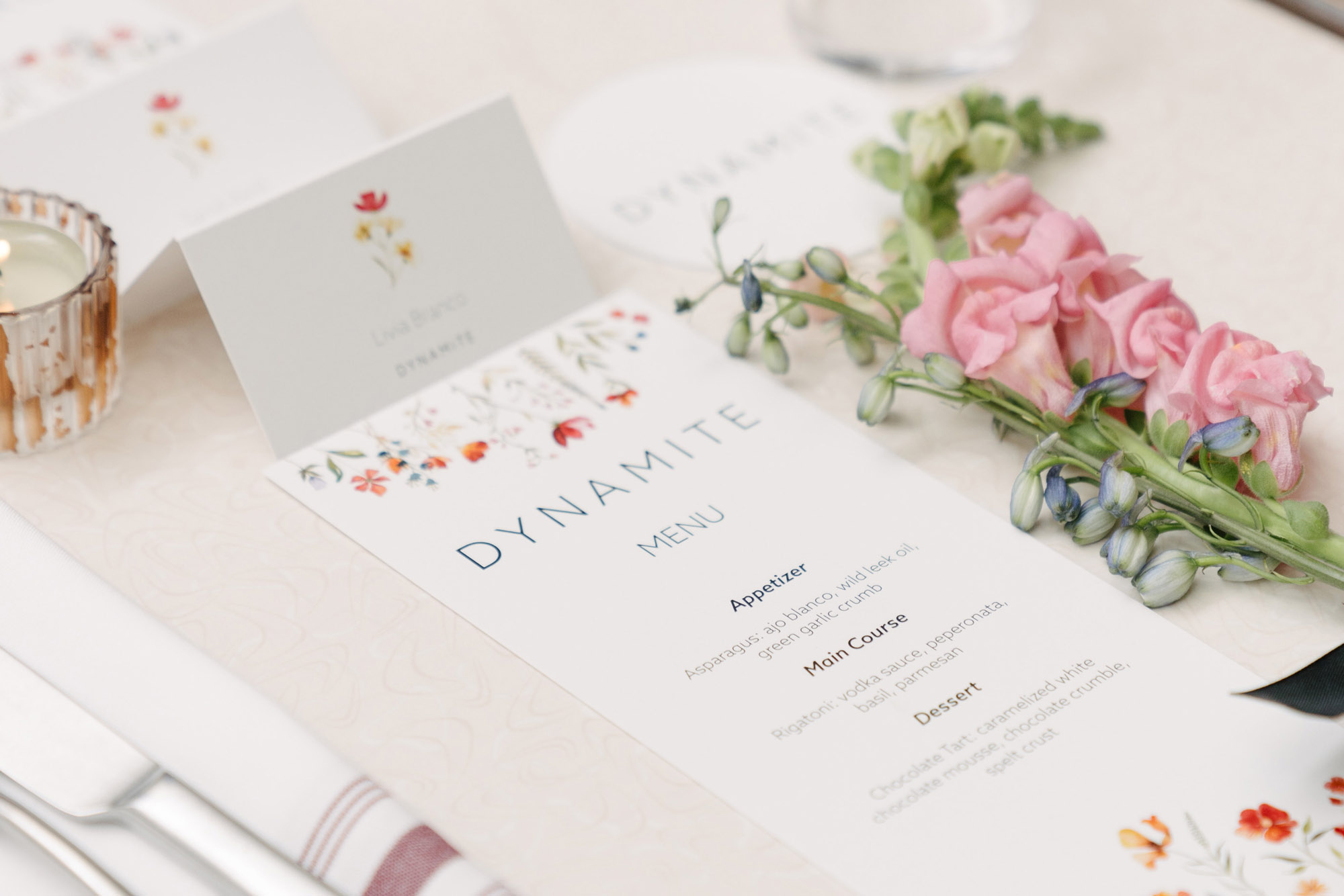 Dynamite event menu with floral table detail