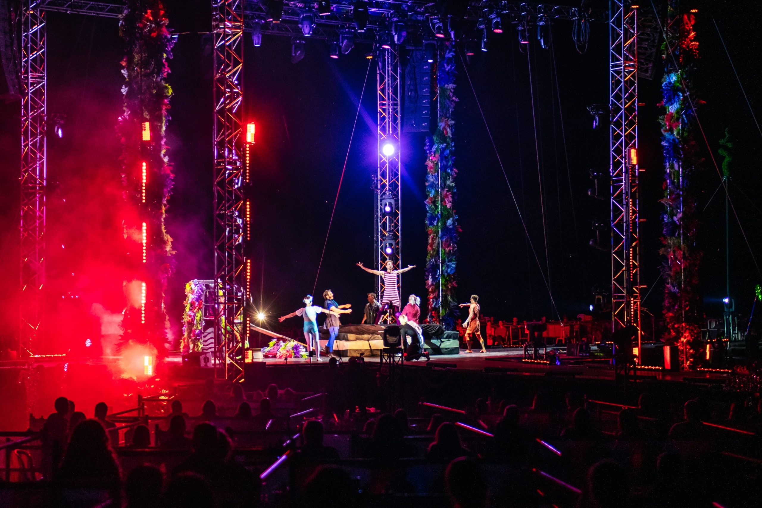 Outdoor stage performance with theatrical lighting