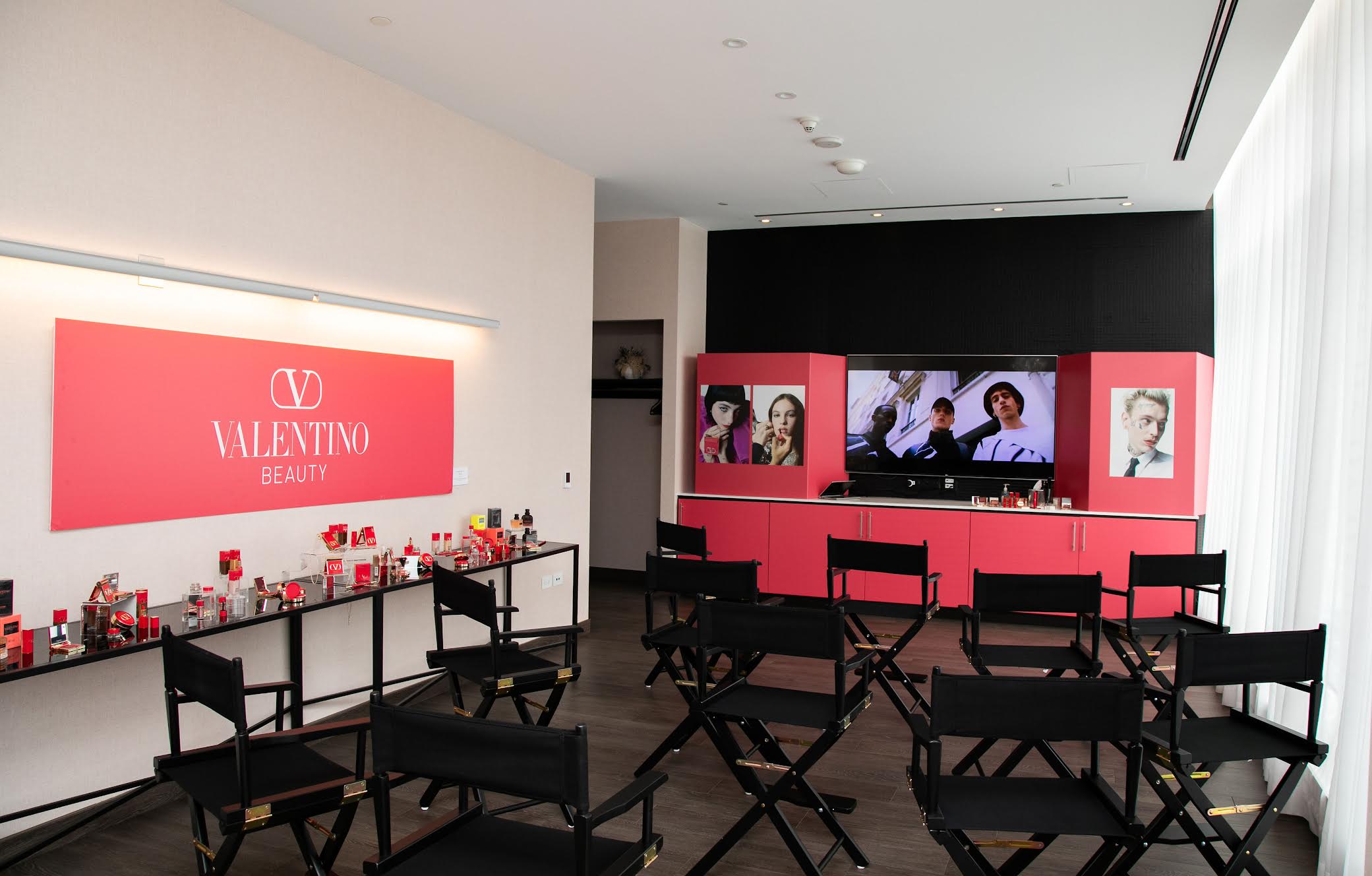 Valentino Beauty classroom with product displays and presentation seating